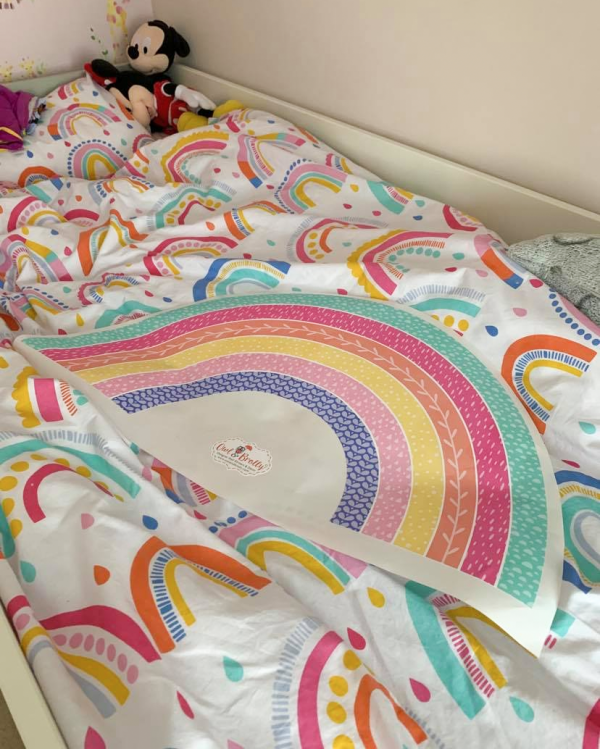 Colour matched rainbow wall sticker to go with rainbow bedding.